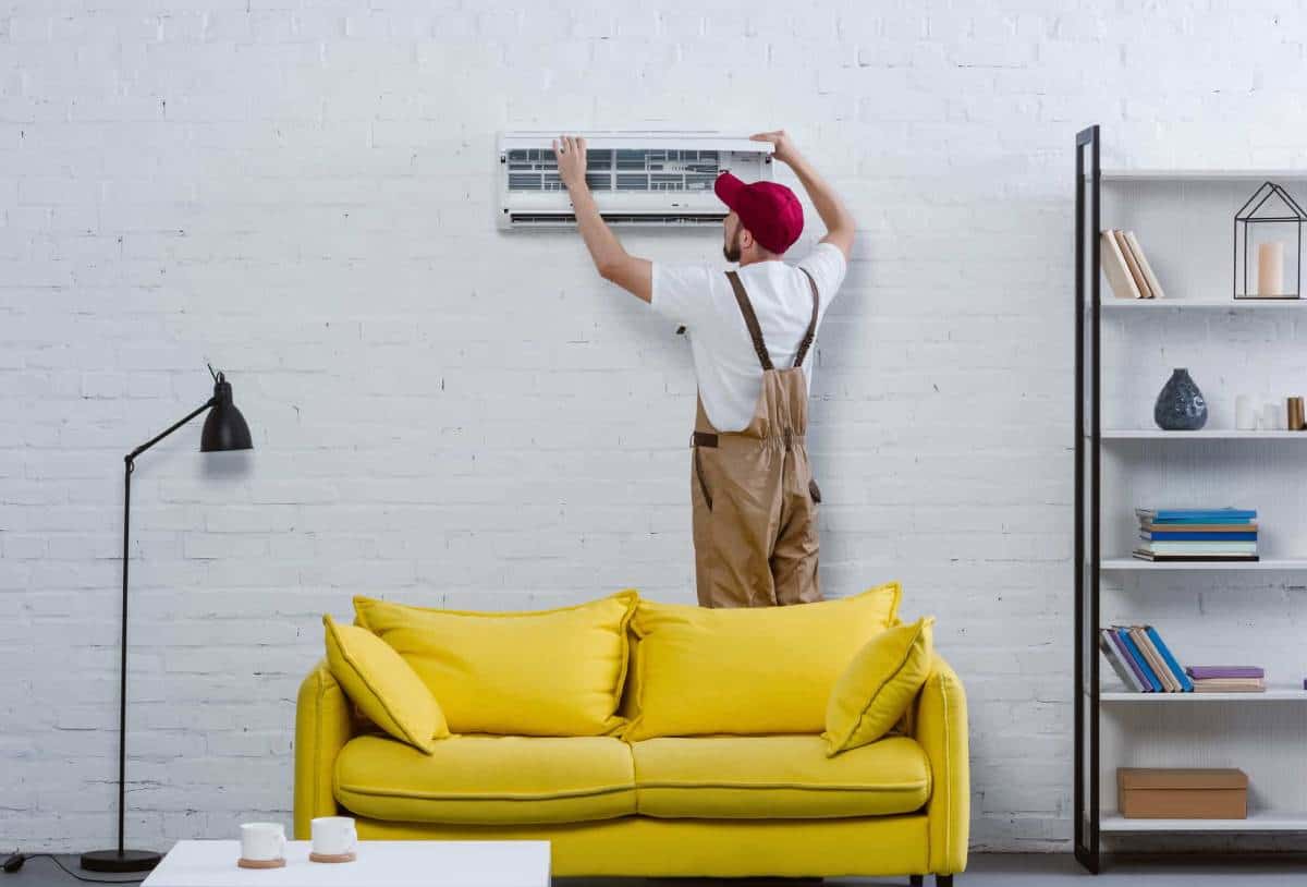 An installer replacing a filter