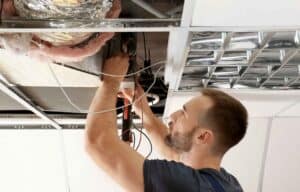 Photo of a person working on a central heating system